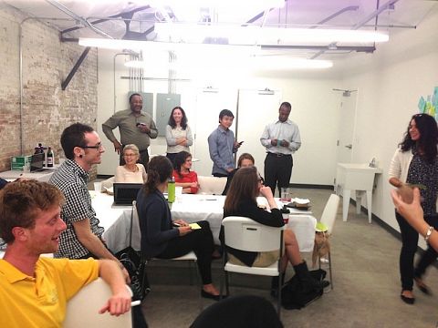 Propeller Fellows at a monthly meeting where we check-in about financial and social-impact numbers and goals moving forward.